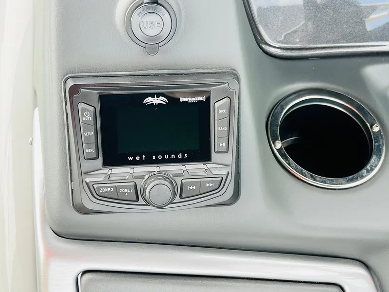 Slide: The Image of 2025 Ranger Reata 223FC boat dashboard with Wet Sounds audio system. - 34
