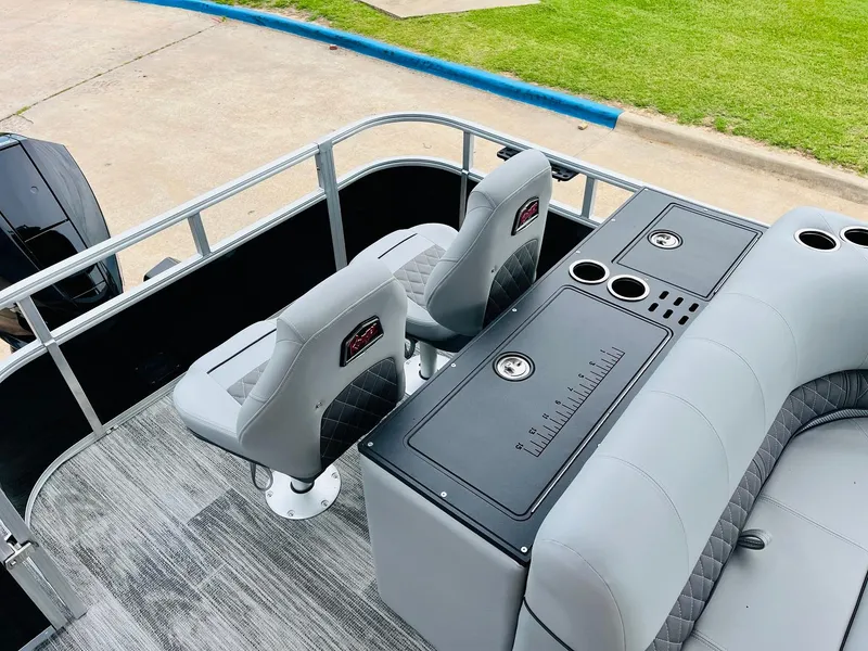 Slide: The Image of 2025 Ranger Reata 223FC boat interior with seating and console. - 40
