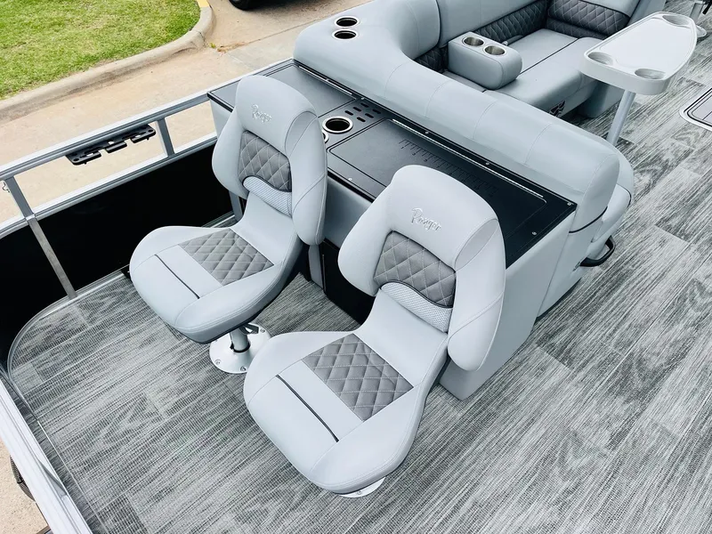 Slide: The Image of 2025 Ranger Reata 223FC boat interior with gray seating and modern design. - 41
