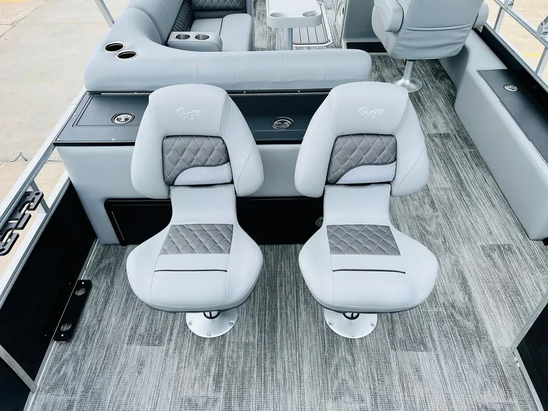 Slide: The Image of 2025 Ranger Reata 223FC boat interior with plush seating and modern design. - 42