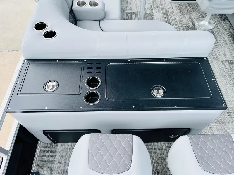 Slide: The Image of 2025 Ranger Reata 223FC boat interior with seating and cup holders. - 43
