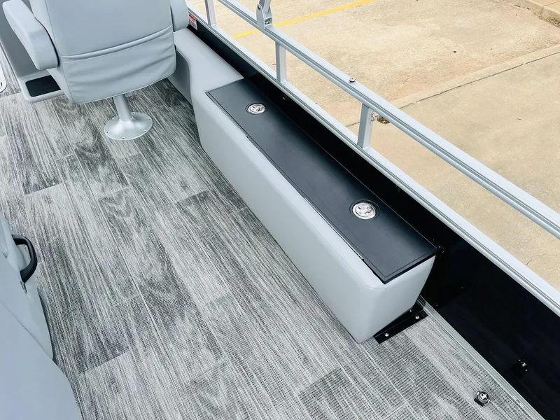 Slide: The Image of 2025 Ranger Reata 223FC boat interior with gray seating and flooring. - 46