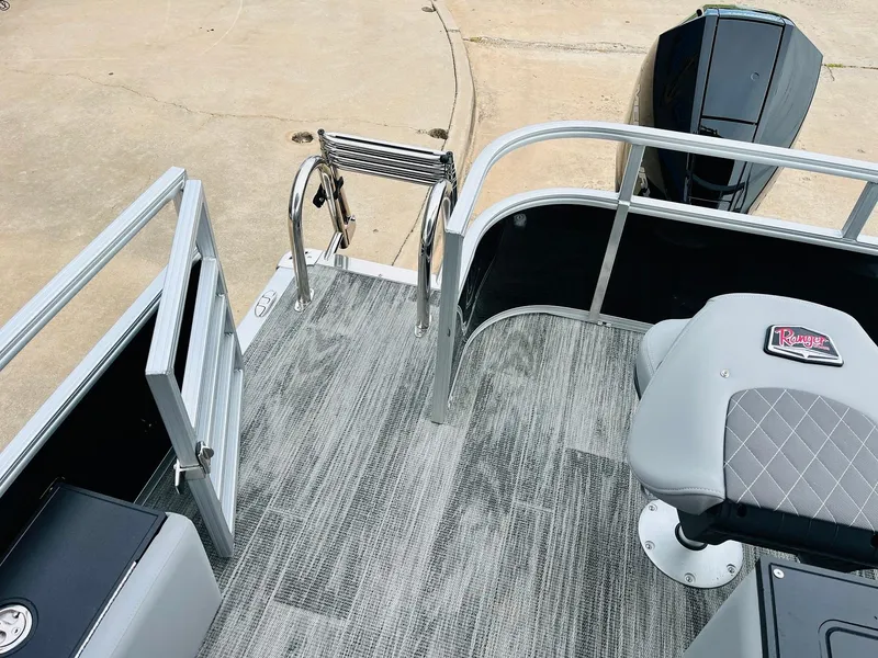 Slide: The Image of 2025 Ranger Reata 223FC boat deck with seating and ladder. - 49