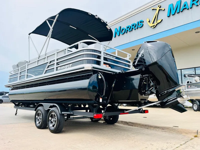 Slide: The Image of 2025 Ranger Reata 223FC pontoon boat with canopy at Norris Marine dealership. - 7