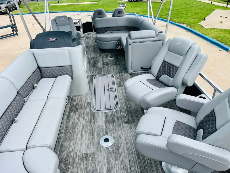Slide: The Image of 2025 Ranger Reata 223FC boat interior with luxurious gray seating and modern design. - 9