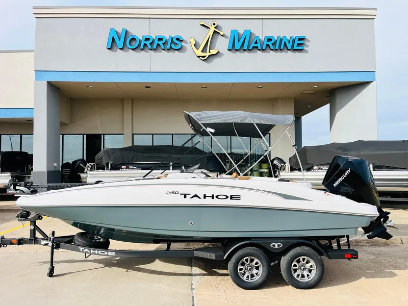 Slide: The Image of 2025 Tahoe 2150 boat on trailer at Norris Marine dealership. - 1