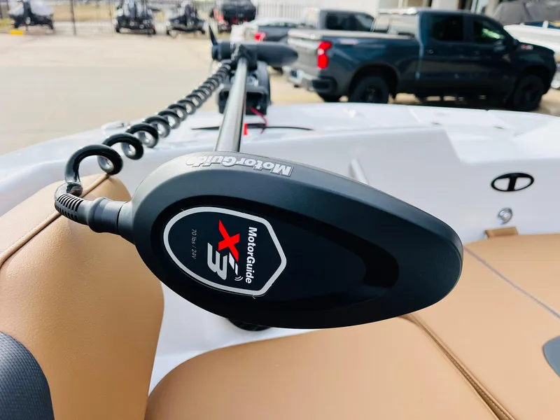 Slide: The Image of MotorGuide X3 trolling motor on 2025 Tahoe 2150 boat, parked outdoors. - 12