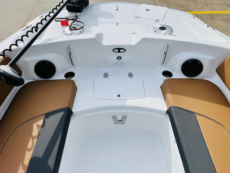 Slide: The Image of Interior of 2025 Tahoe 2150 boat with tan and gray seating. - 18