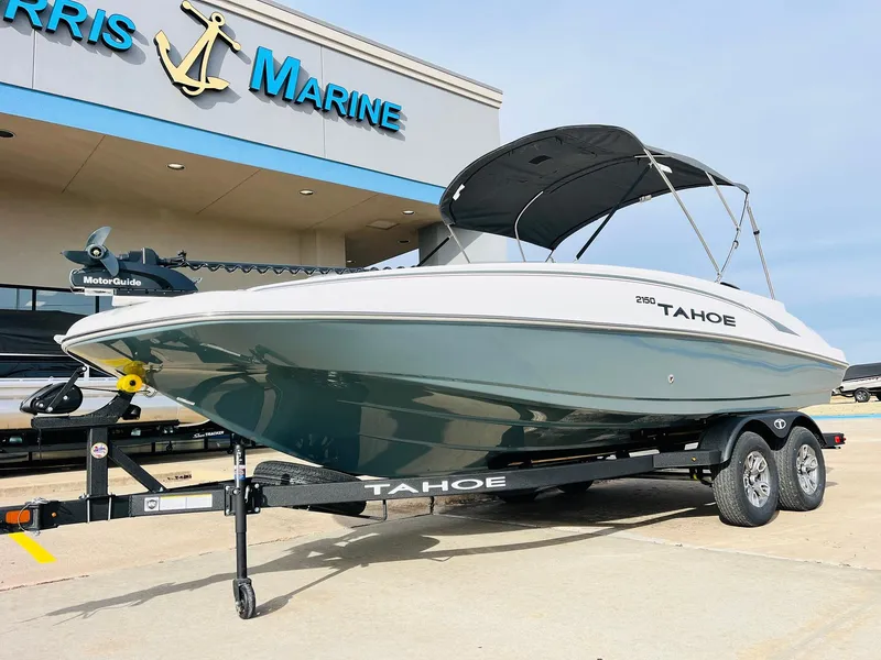 Slide: The Image of 2025 Tahoe 2150 boat on trailer at Norris Marine dealership. - 2