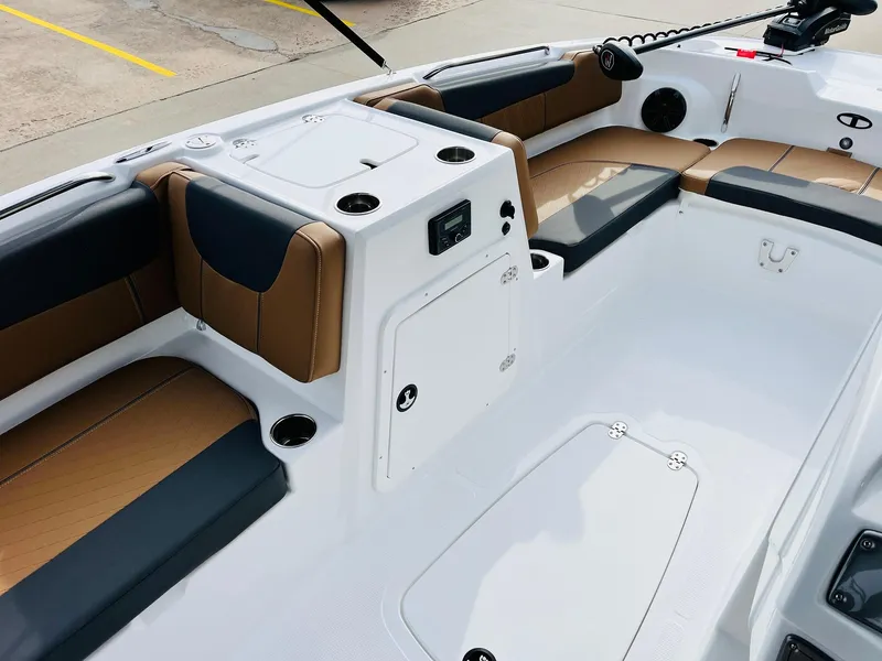 Slide: The Image of Interior of 2025 Tahoe 2150 boat with tan and black seating. - 21