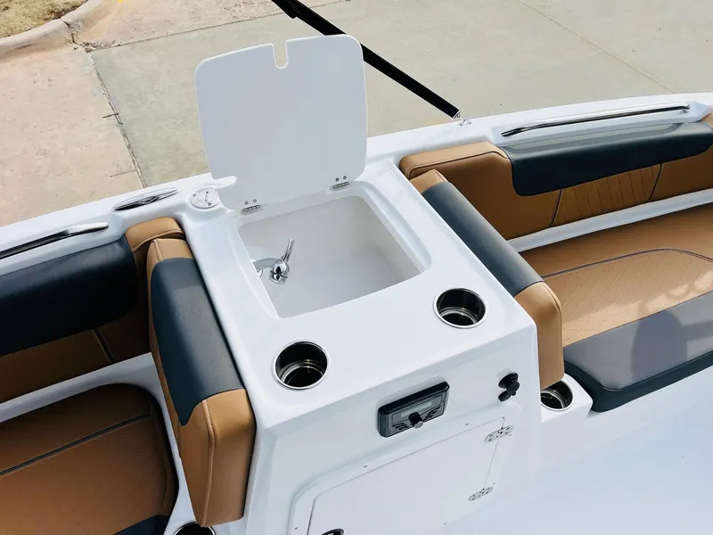 Slide: The Image of 2025 Tahoe 2150 boat interior with sink and cup holders. - 24