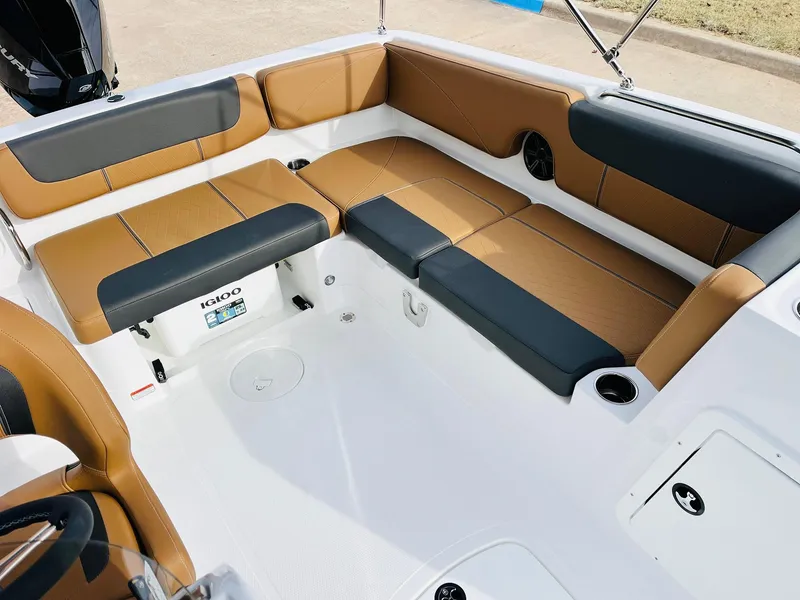 Slide: The Image of 2025 Tahoe 2150 boat interior with tan and black seating, spacious and modern design. - 26