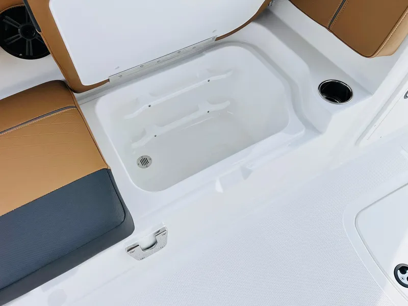 Slide: The Image of 2025 Tahoe 2150 boat interior with storage compartment and seating. - 27