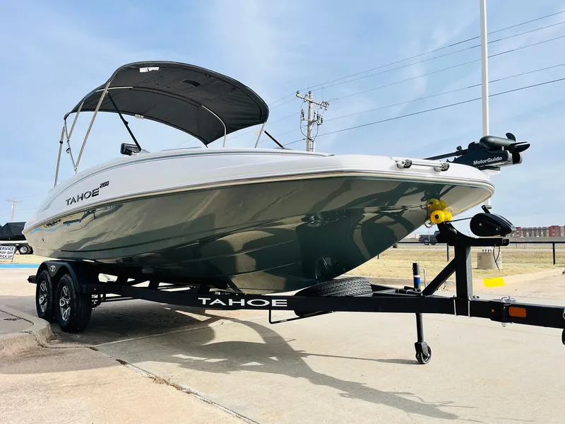 Slide: The Image of 2025 Tahoe 2150 boat on trailer, sleek design, outdoor display. - 3