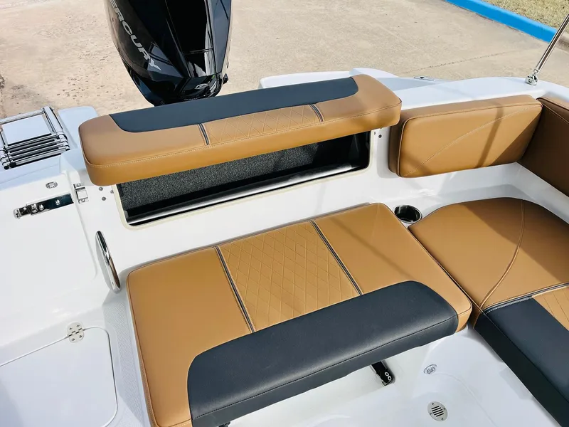 Slide: The Image of 2025 Tahoe 2150 boat interior with tan and black seating. - 30