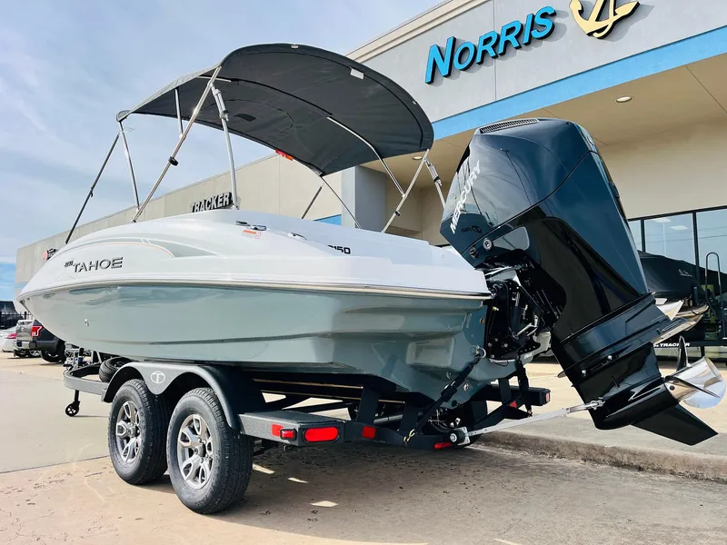Slide: The Image of 2025 Tahoe 2150 boat on trailer outside Norris dealership. - 8