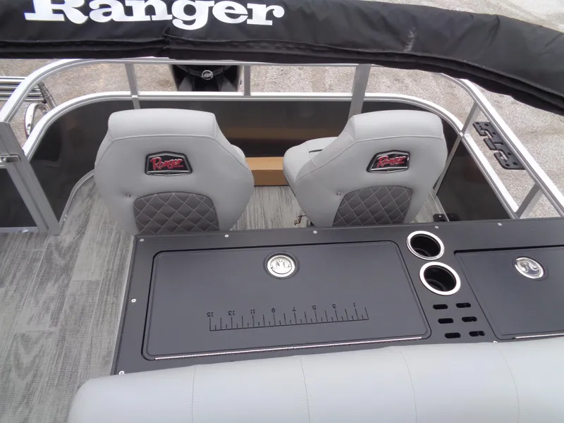 Slide: The Image of 2025 Ranger Reata 220FC boat interior with dual seats and fishing station. - 14