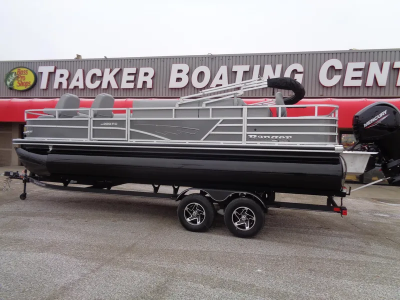 Slide: The Image of 2025 Ranger Reata 220FC pontoon boat at Tracker Boating Center. - 2