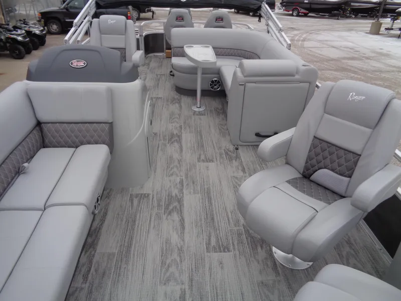 Slide: The Image of 2025 Ranger Reata 220FC boat interior with luxurious gray seating and modern design. - 7