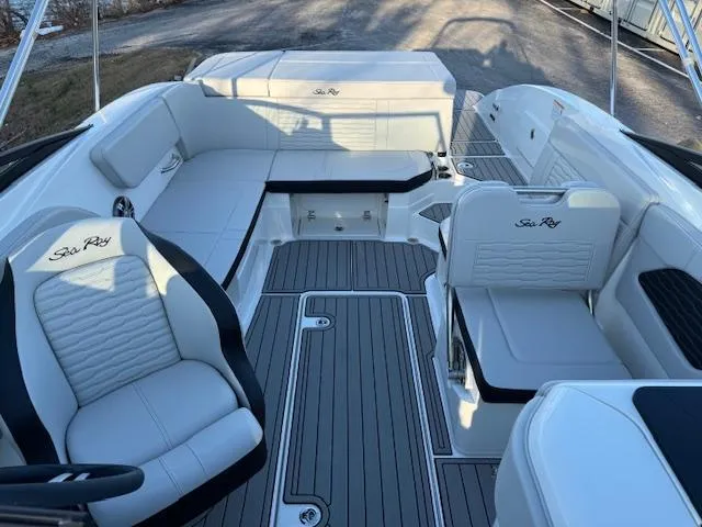 Slide: The Image of 2025 Sea Ray SPX 230 boat interior with white seating and sleek design. - 3