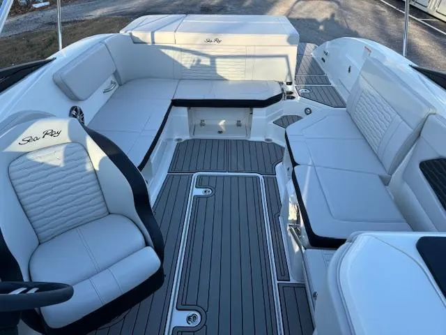 Slide: The Image of 2025 Sea Ray SPX 230 boat interior with white seating and sleek design. - 4