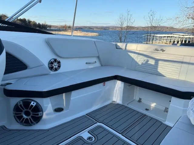 Slide: The Image of 2025 Sea Ray SPX 230 boat interior with lake view, featuring sleek seating and modern design. - 6