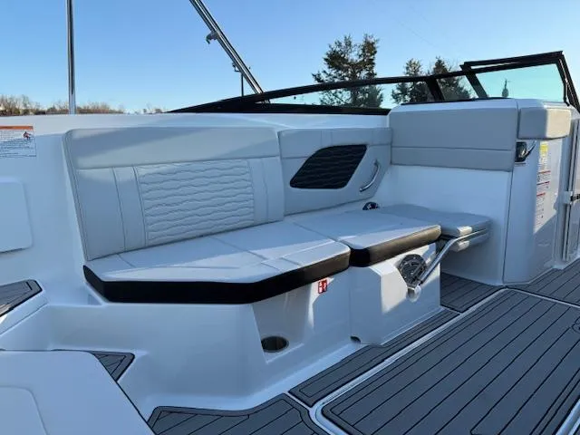 Slide: The Image of 2025 Sea Ray SPX 230 boat interior with sleek seating and modern design. - 7