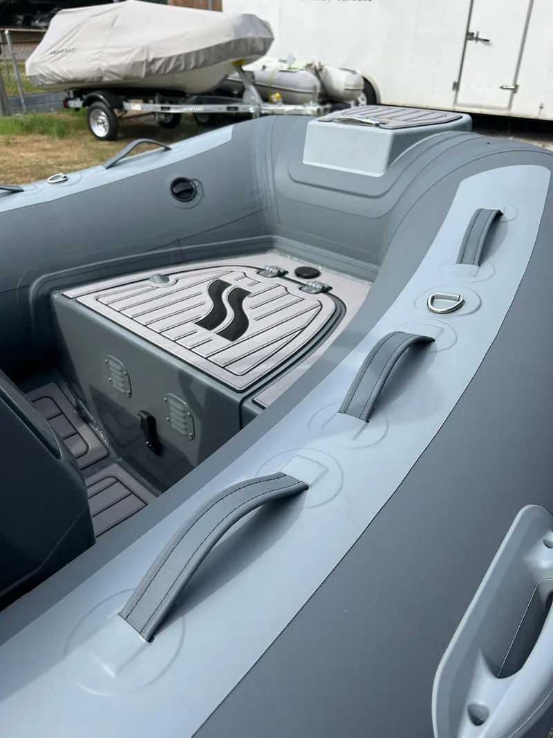 Slide: The Image of 2023 Highfield Classic 340 GT boat interior with seating and storage compartments. - 12