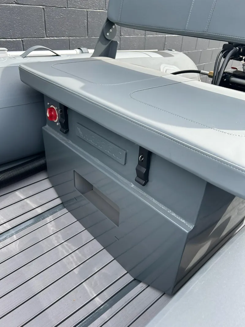 Slide: The Image of 2023 Highfield Classic 340 GT boat interior with sleek seating and storage. - 14