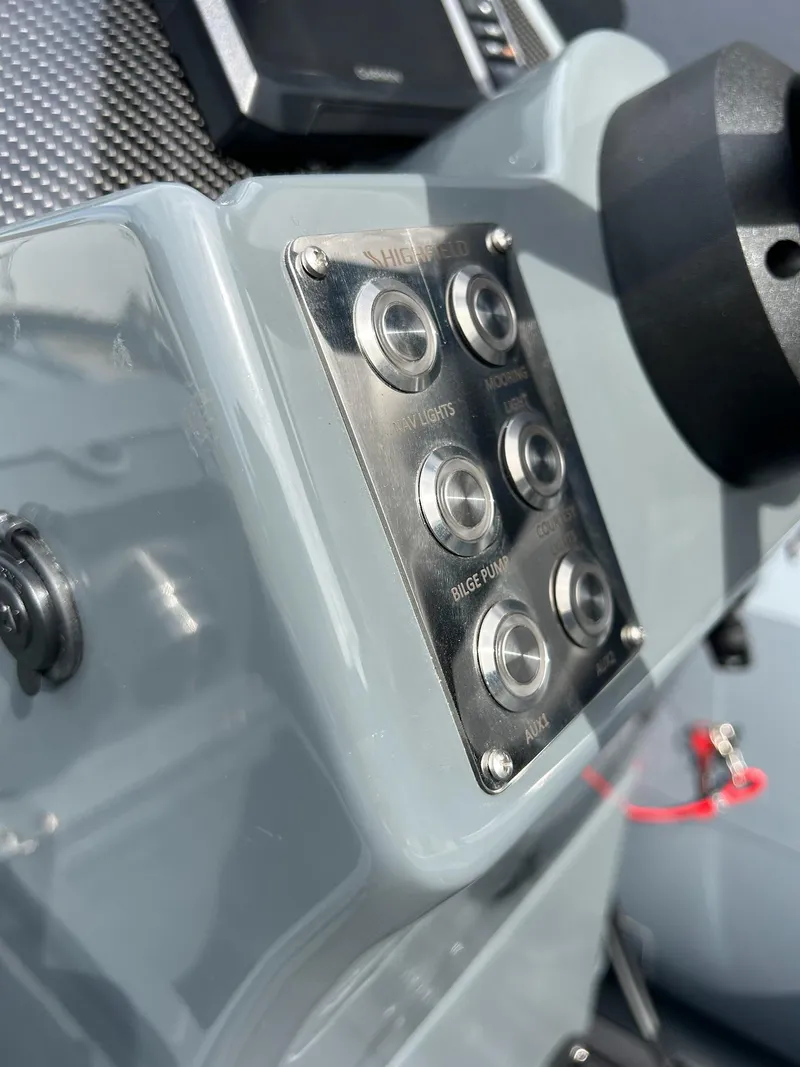 Slide: The Image of Control panel of 2023 Highfield Classic 340 GT boat, featuring multiple buttons. - 16