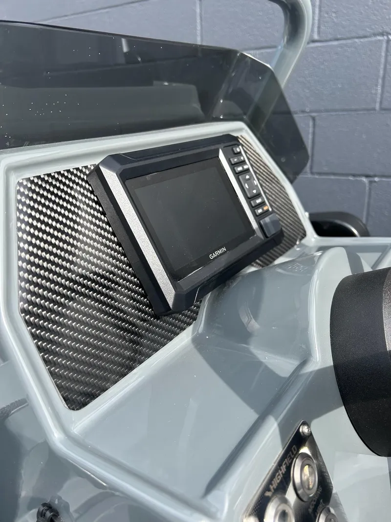 Slide: The Image of 2023 Highfield Classic 340 GT dashboard with Garmin display and carbon fiber panel. - 17