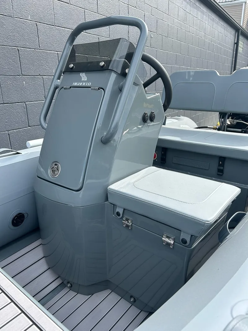 Slide: The Image of 2023 Highfield Classic 340 GT boat interior with steering console and seat. - 20