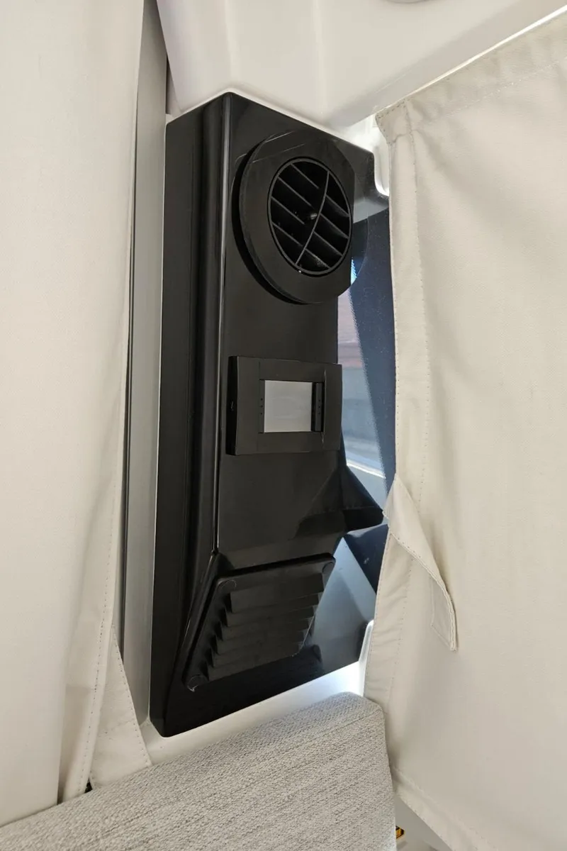 Slide: The Image of 2023 Jeanneau NC795 interior vent detail with curtain. - 21
