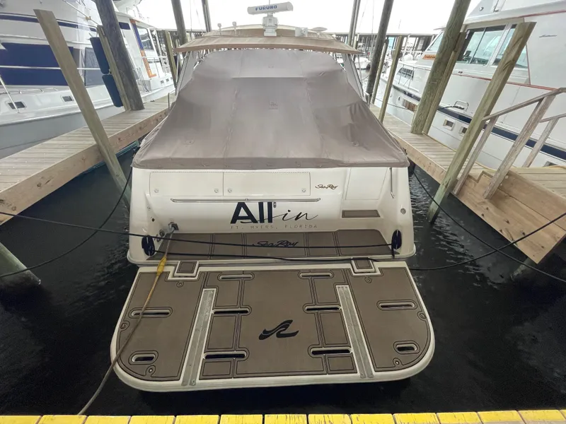 Slide: The Image of 1996 Sea Ray 500 Sundancer docked, covered, rear view. - 19