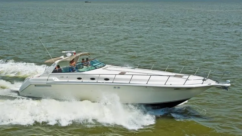 Slide: The Image of 1996 Sea Ray 500 Sundancer cruising on open water. - 2