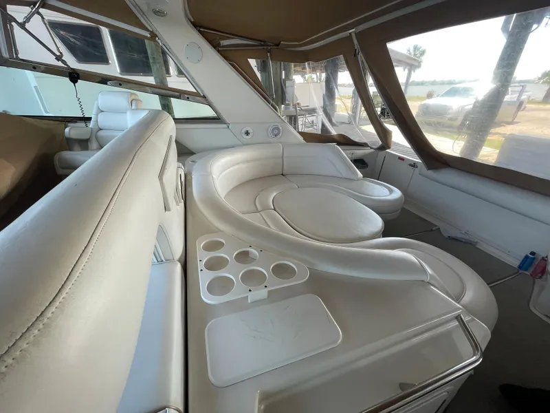 Slide: The Image of Luxurious interior of 1996 Sea Ray 500 Sundancer yacht with white leather seating. - 28