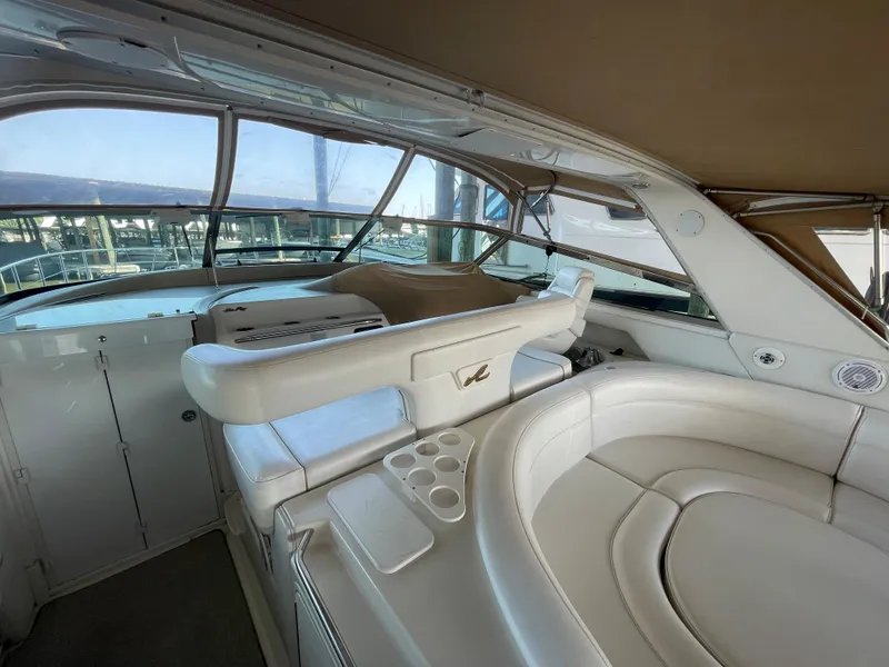 Slide: The Image of Interior of 1996 Sea Ray 500 Sundancer yacht with white leather seating. - 30