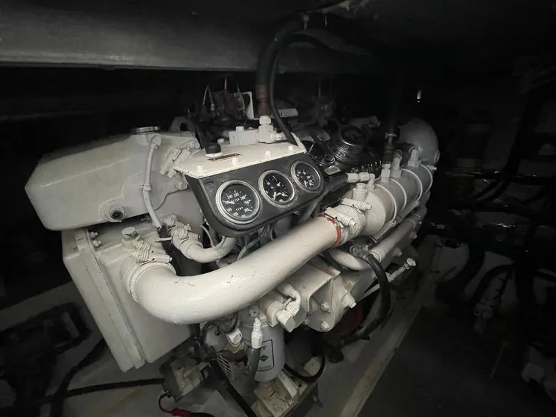 Slide: The Image of Engine of 1996 Sea Ray 500 Sundancer yacht with gauges and pipes. - 33