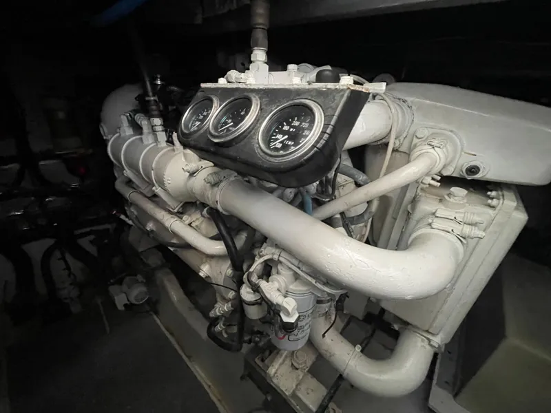 Slide: The Image of Engine room of 1996 Sea Ray 500 Sundancer with gauges and pipes. - 34
