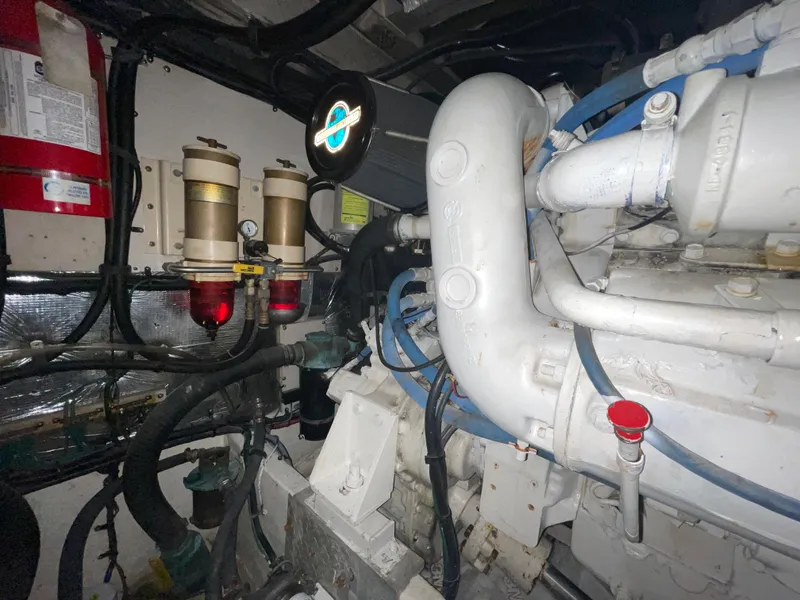 Slide: The Image of Engine room of 1996 Sea Ray 500 Sundancer with visible components and wiring. - 36