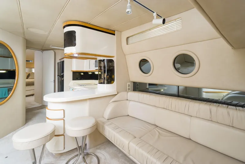Slide: The Image of Luxurious interior of 1996 Sea Ray 500 Sundancer yacht with modern seating and bar area. - 45
