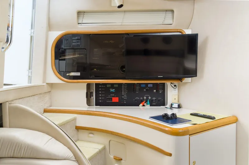 Slide: The Image of Interior of 1996 Sea Ray 500 Sundancer yacht with control panel and TV. - 47