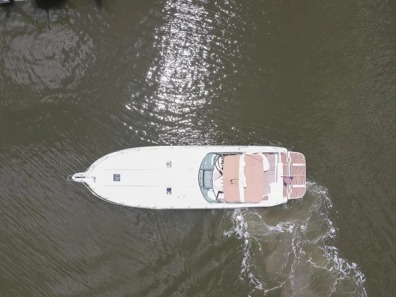Slide: The Image of Aerial view of 1996 Sea Ray 500 Sundancer yacht cruising on water. - 8