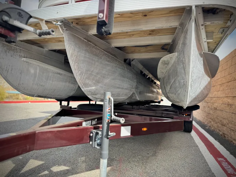Slide: The Image of 2021 Bennington 23 LS RSD pontoon boat on trailer, viewed from below. - 4
