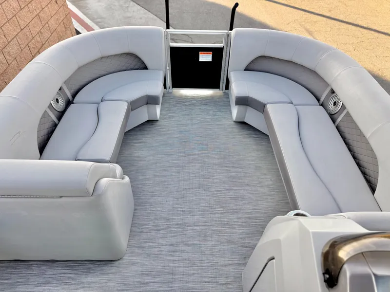 Slide: The Image of 2021 Bennington 23 LPD pontoon boat with spacious gray seating and modern design. - 11