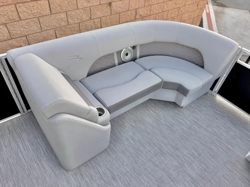 Slide: The Image of 2021 Bennington 23 LPD boat interior with gray seating and cup holder. - 12