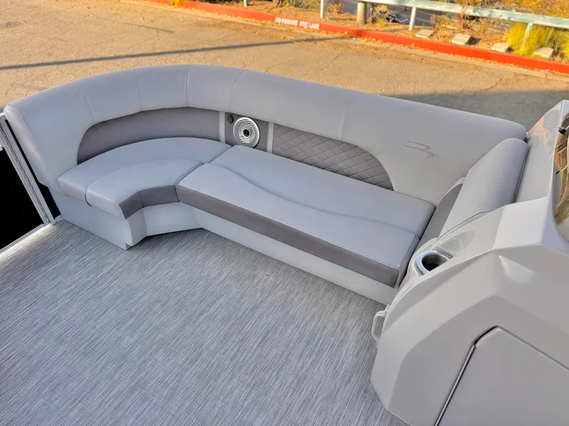 Slide: The Image of 2021 Bennington 23 LPD pontoon boat interior with gray seating and speaker. - 13