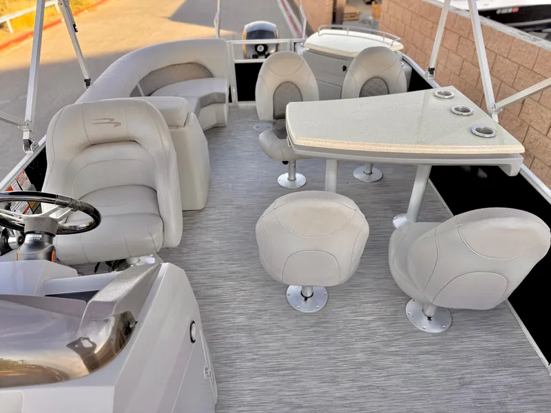 Slide: The Image of 2021 Bennington 23 LPD pontoon boat interior with seating and table. - 14
