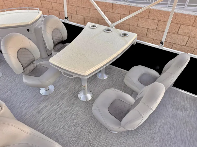 Slide: The Image of 2021 Bennington 23 LPD boat interior with seating and table setup. - 15
