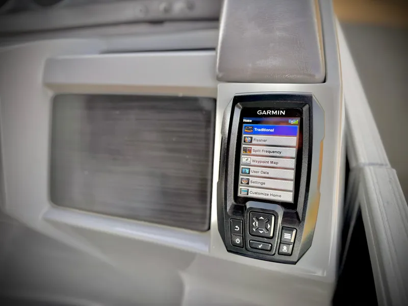 Slide: The Image of Garmin navigation system on 2021 Bennington 23 LPD boat dashboard. - 22